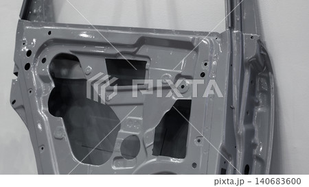 Car door metal sheet. Close up automotive door inner panels and stamped steel body parts. Modern vehicle manufacturing facility. Precision metal forming. Metal Car doors automotive assembly technology 140683600