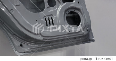 Car door metal sheet. Close up automotive door inner panels and stamped steel body parts. Modern vehicle manufacturing facility. Precision metal forming. Metal Car doors automotive assembly technology Car door metal sheet. Close up automotive door inner panels and stamped steel body parts. Modern vehicle manufacturing facility. Precision metal forming. Metal Car doors automotive assembly technology 140683601