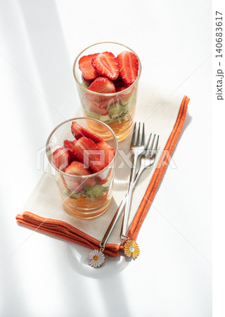 Two fruit cups with fresh strawberries, kiwi, and jelly Two fruit cups with fresh strawberries, kiwi, and jelly 140683617