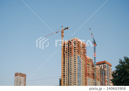 High rise building under construction with tower crane High rise building under construction with tower crane 140683908