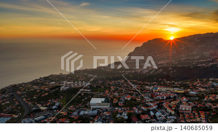 Aerial sunset over Madeira near Camara de Lobos and Funchal ridge Aerial sunset over Madeira near Camara de Lobos and Funchal ridge 140685059