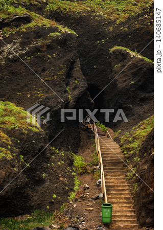 Concrete stairway and cave entrance in volcanic rock, Madeira Concrete stairway and cave entrance in volcanic rock, Madeira 140685147