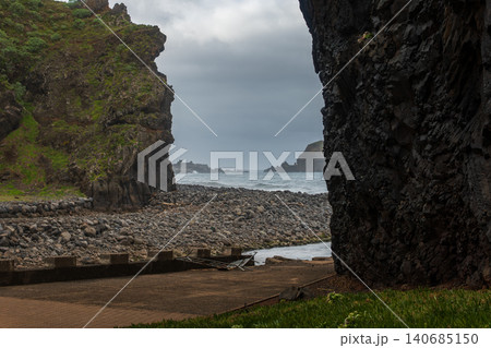 Basalt cove gateway on Madeira's north coast with sea stacks and surf Basalt cove gateway on Madeira's north coast with sea stacks and surf 140685150