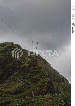 Cliffside viewpoint and metal frame on coastal hill, Madeira, Portugal 140685159