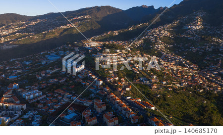 Aerial terraced neighborhoods on Madeira hills near Funchal at dusk Aerial terraced neighborhoods on Madeira hills near Funchal at dusk 140685170