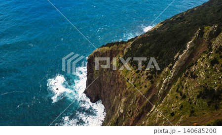 Aerial sea cliff on Madeira with rugged headland and Atlantic waves Aerial sea cliff on Madeira with rugged headland and Atlantic waves 140685200
