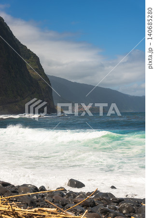 Volcanic cliffs and pebble beach on Madeira's north coast, Portugal Volcanic cliffs and pebble beach on Madeira's north coast, Portugal 140685280
