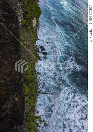 Atlantic surf crashes below basalt cliff on Madeira coastline Atlantic surf crashes below basalt cliff on Madeira coastline 140685304
