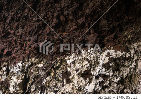 Volcanic cliff layers on Madeira with scoria over ash rich tuff Volcanic cliff layers on Madeira with scoria over ash rich tuff 140685313