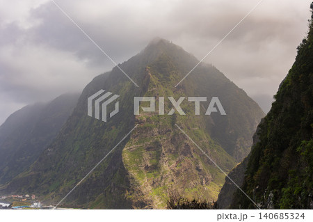Pyramid peak on Madeira near Sao Vicente under low clouds and mist Pyramid peak on Madeira near Sao Vicente under low clouds and mist 140685324