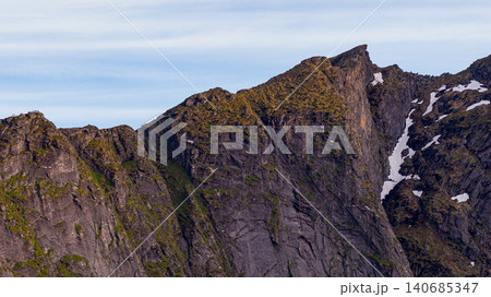 Lofoten Islands Dramatic Mountain Peaks with Snow and Moss Lofoten Islands Dramatic Mountain Peaks with Snow and Moss 140685347