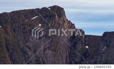 Dramatic Lofoten Mountains with Columnar Basalt Formations Norway 140685350