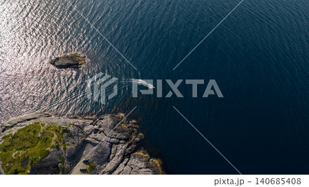Aerial View of Whale near Rocky Coastline in Lofoten Norway 140685408