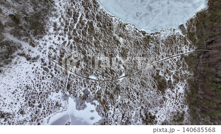 Aerial View of Snow Covered Wetland with Wooden Boardwalk 140685568