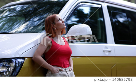 Woman enjoying freedom by camper van in nature Woman enjoying freedom by camper van in nature 140685798