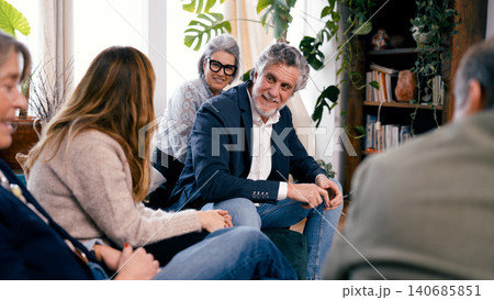 Seniors friends gathering, smiling and enjoying conversation Seniors friends gathering, smiling and enjoying conversation 140685851