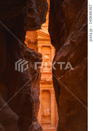 Petra, Wadi Musa, Jordan - Mar 06 2023, view of Al-Khazneh tomb from Siq Gorge, symbol of the city of Petra, Wadi Musa, Jordan 140686367