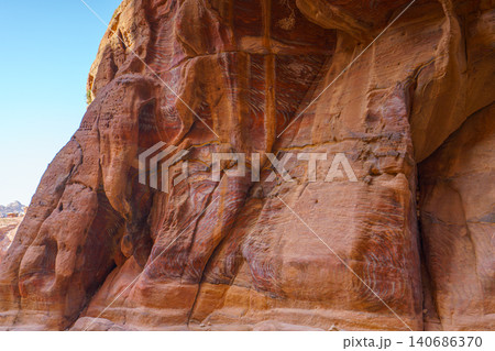 Panoramic view of Siq Gorge canyon cliffs and rocks at daytime, Petra, Wadi Musa, Jordan Panoramic view of Siq Gorge canyon cliffs and rocks at daytime, Petra, Wadi Musa, Jordan 140686370