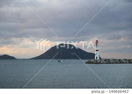 Seascape at sunshine. Lighthouse and sailings on the coast. Seaside town of Turgutreis and spectacular sunshine 140686467