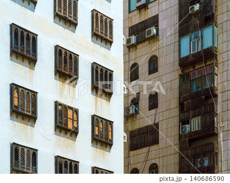 Jeddah, Saudi Arabia, bottom up, panoramic view of Arabian apartment house with mashrabiya on it, at daytime in old town of Jeddah Jeddah, Saudi Arabia, bottom up, panoramic view of Arabian apartment house with mashrabiya on it, at daytime in old town of Jeddah 140686590