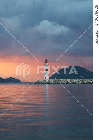 Seascape at sunshine. Lighthouse and sailings on the coast. Seaside town of Turgutreis and spectacular sunshine 140686626