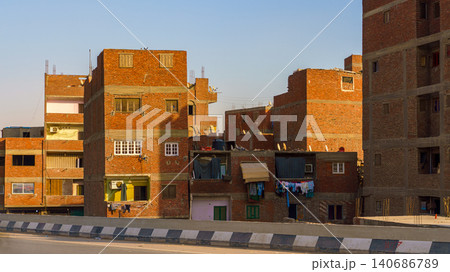 Cairo, Egypt - Mar 11 2023, panoramic view of the slum while driving on the highway, at daytime, Cairo, Egypt Cairo, Egypt - Mar 11 2023, panoramic view of the slum while driving on the highway, at daytime, Cairo, Egypt 140686789