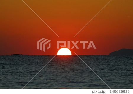 Close-up of empty sky and sun for copy space. The spectacular view of the sunset was breathtaking, with the sun sinking behind the clouds on the horizon. 140686923