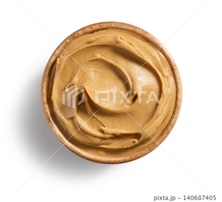 Bowl of Peanut Butter with Swirl Texture Isolated on White Background, Top View Bowl of Peanut Butter with Swirl Texture Isolated on White Background, Top View 140687405