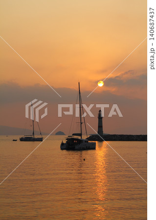 Seascape at sunshine. Lighthouse and sailings on the coast. Seaside town of Turgutreis and spectacular sunshine 140687437