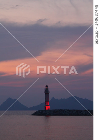 Seascape at sunshine. Lighthouse and sailings on the coast. Seaside town of Turgutreis and spectacular sunshine 140687448
