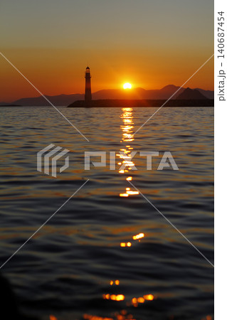 Seascape at sunshine. Lighthouse and sailings on the coast. Seaside town of Turgutreis and spectacular sunshine 140687454