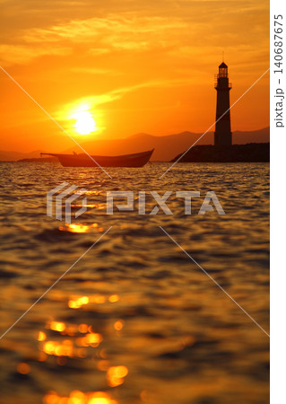 Seascape at sunshine. Lighthouse and sailings on the coast. Seaside town of Turgutreis and spectacular sunshine 140687675