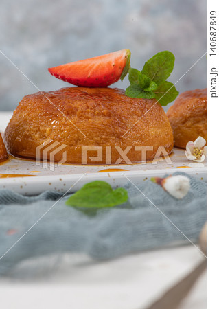 Caramel custard pudding  on plate over modern background with copy space. 140687849