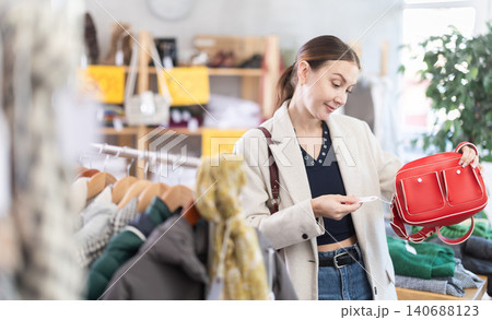 woman in the top one chooses a bag 140688123