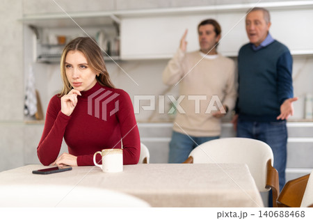 Two men quarreling with young woman Two men quarreling with young woman 140688468