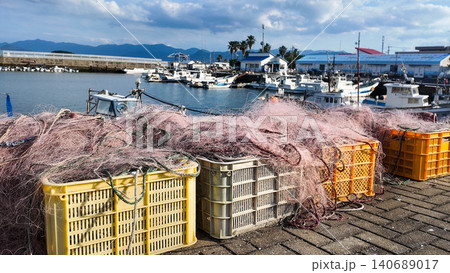 Commercial fishing nets on plastic crates at a traditional fishing harbor. Commercial fishing nets on plastic crates at a traditional fishing harbor. 140689017
