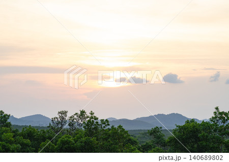 Sunrise over tropical forest and mountain landscape. Untouched wilderness beauty, environmental conservation and sustainable tourism destinations. Climate awareness, biodiversity conservation. Sunrise over tropical forest and mountain landscape. Untouched wilderness beauty, environmental conservation and sustainable tourism destinations. Climate awareness, biodiversity conservation. 140689802
