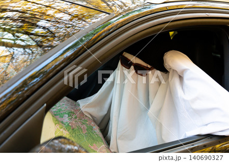 Ghost Driver Navigating Route With Map Inside Car 140690327