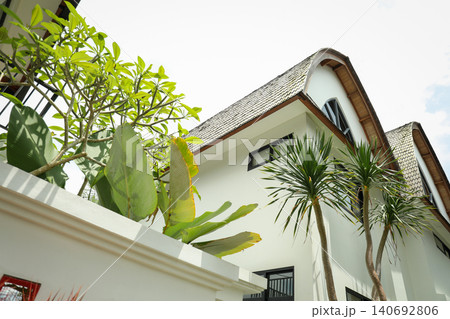 House in Bali with green plants and a distinctive roof style House in Bali with green plants and a distinctive roof style 140692806