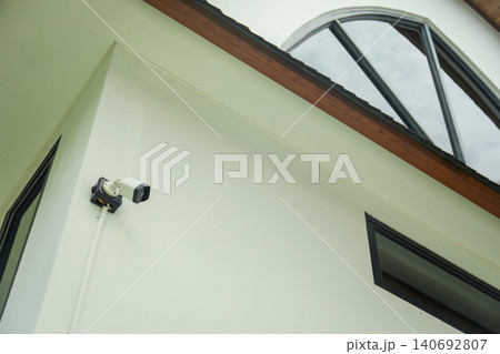 A security camera is mounted on a building in Bali A security camera is mounted on a building in Bali 140692807