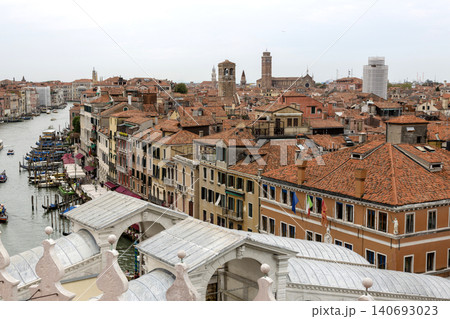 Venice, Italy - August 22, 2019: View of Venice from the roof of a house. Venice, Italy - August 22, 2019: View of Venice from the roof of a house. 140693023