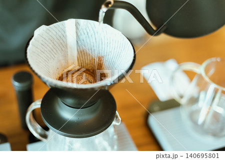 Barista making drip coffee. 140695801