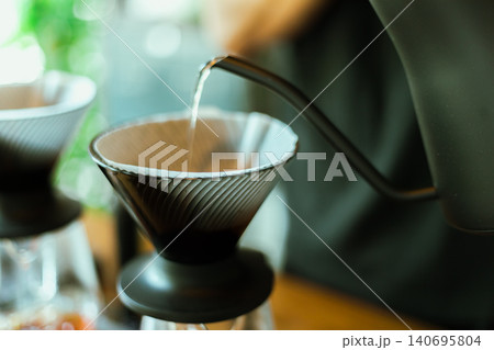 Barista making drip coffee. 140695804