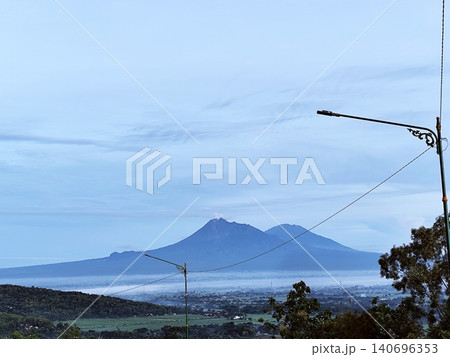 View of Mount Merapi and Merbabu on a bright morning View of Mount Merapi and Merbabu on a bright morning 140696353