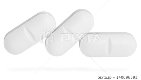 Different pills in row isolated on white. White medicine tablet, clearly depicting shape and the distinct central score line for easy division. Different pills in row isolated on white. White medicine tablet, clearly depicting shape and the distinct central score line for easy division. 140696393