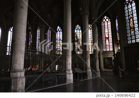 Gothic Cathedral Nave With Row of Stone Columns and Stained Glass Windows Gothic Cathedral Nave With Row of Stone Columns and Stained Glass Windows 140696422