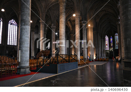 Gothic Cathedral Nave With Stone Columns Pews and Temporary Exhibition Display Gothic Cathedral Nave With Stone Columns Pews and Temporary Exhibition Display 140696430