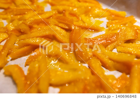 Top view of homemade candied orange peels drying Top view of homemade candied orange peels drying 140696848