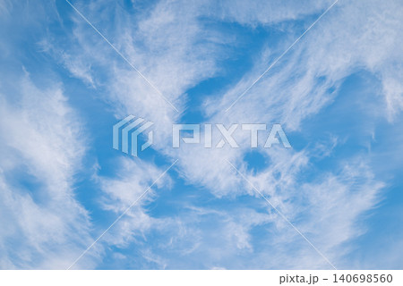 Landscape of clouds in blue sky. Abstract clouds in different shapes melting in sky Landscape of clouds in blue sky. Abstract clouds in different shapes melting in sky 140698560