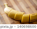 Sliced banana on the wooden table, close up. Healthy food, vitamins, tropical fruit, breakfast concept 140698600